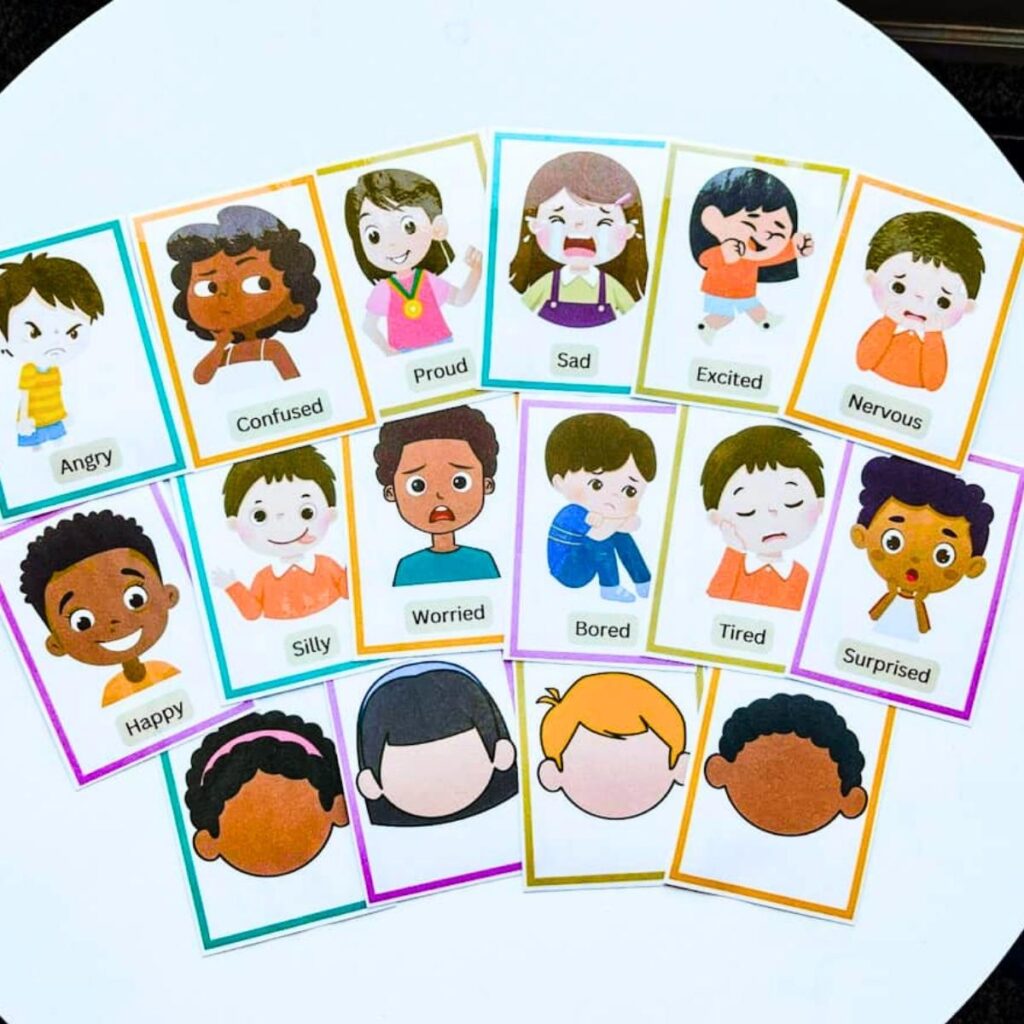 complete set of 12 emotion flash cards and 4 blank face flashcards sitting on a table