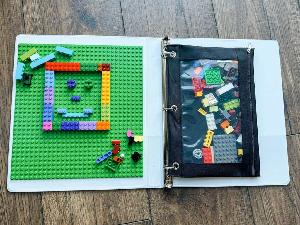 DIY Travel Lego Case opened up on ground with smile face made out of legos