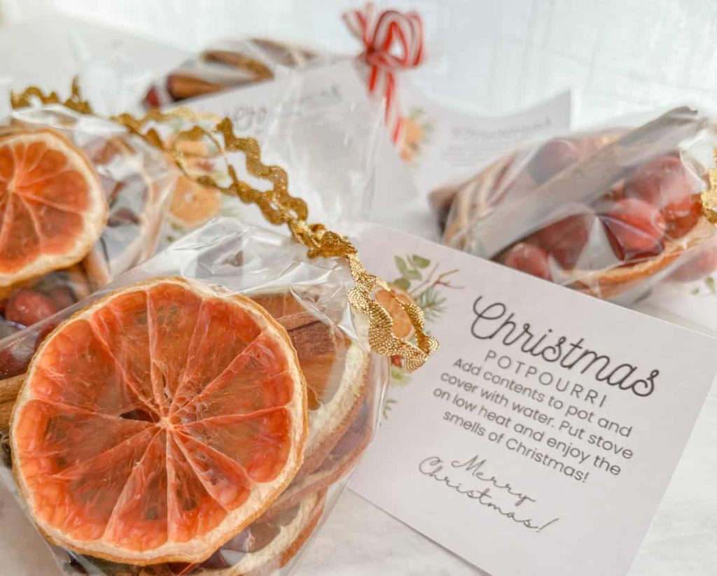 christmas potpourri gift tag and bag sitting on the counter with others
