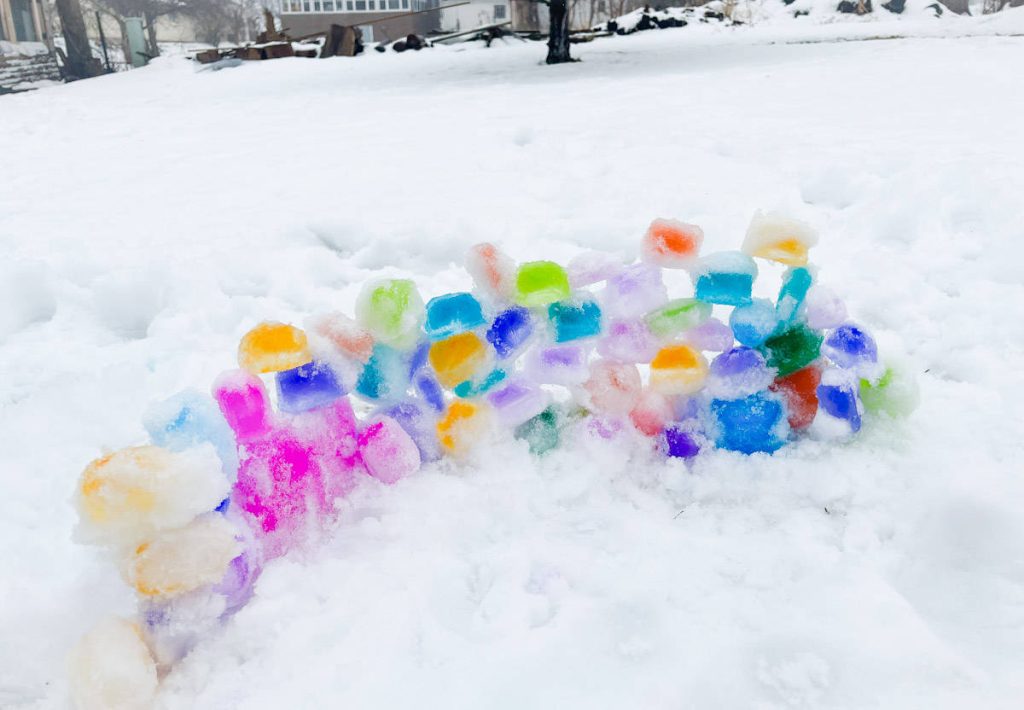 colorful ice sculpture on the snowy ground 