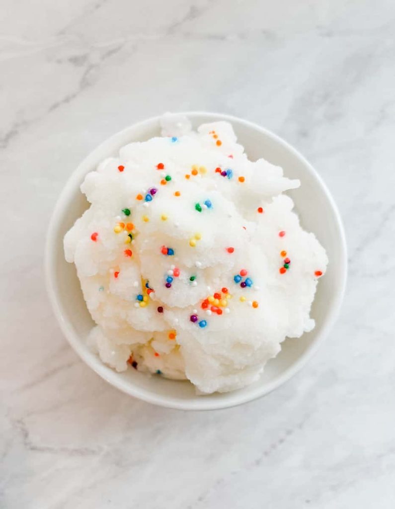 vanilla snow cream with sprinkles sitting on a counter top