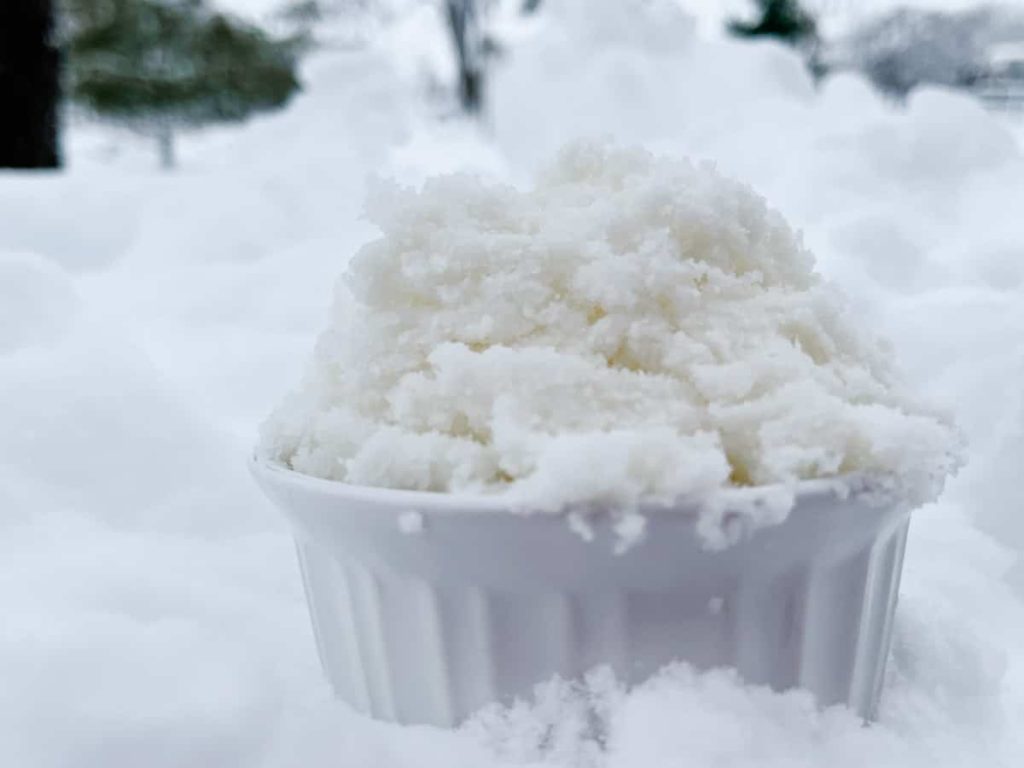 Bow of vanilla snow cream sitting in the snow