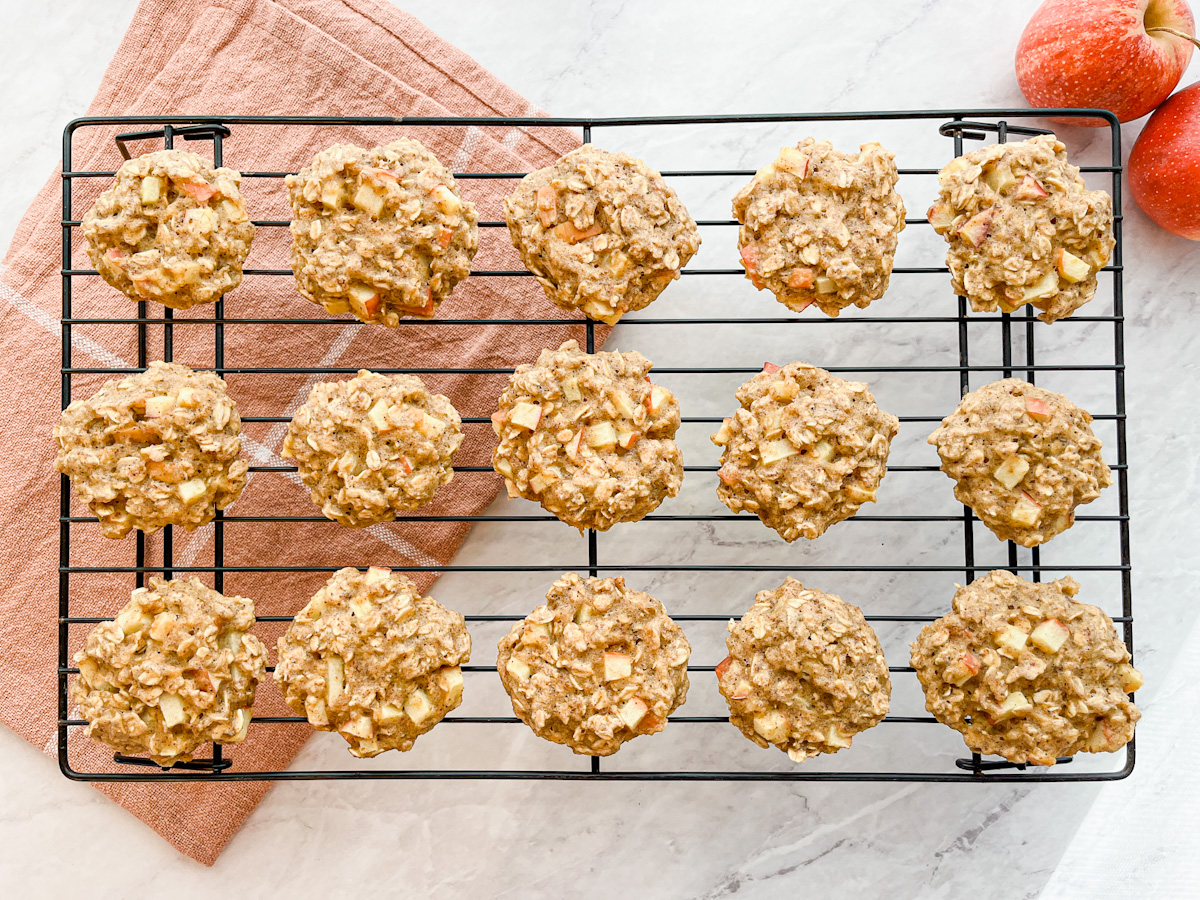 Apple pie breakfast cookies cooling on wire rack on counter.