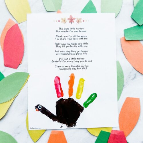 completed handprint turkey poem craft with leaves around it