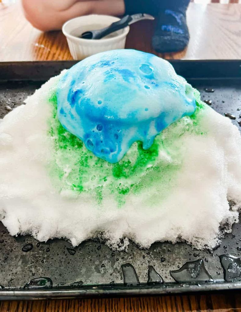 snow volcano erupting blue foam