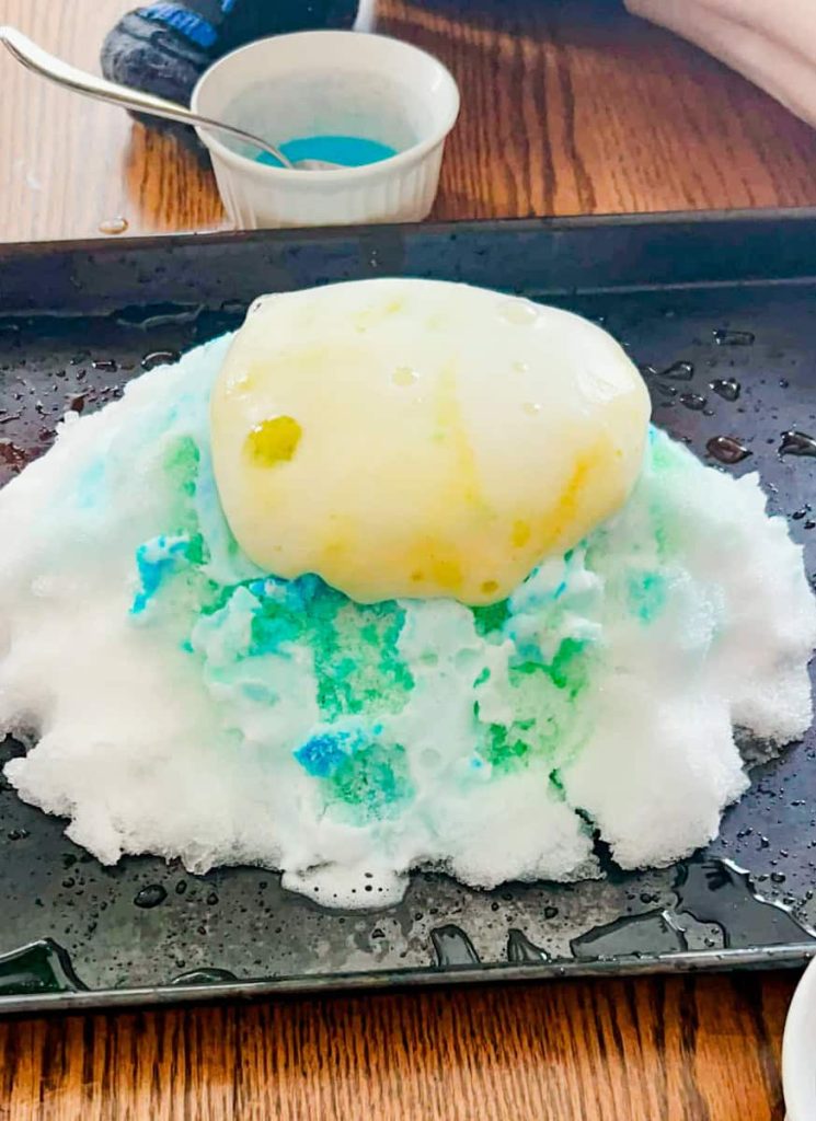 snow volcano erupting yellow foam