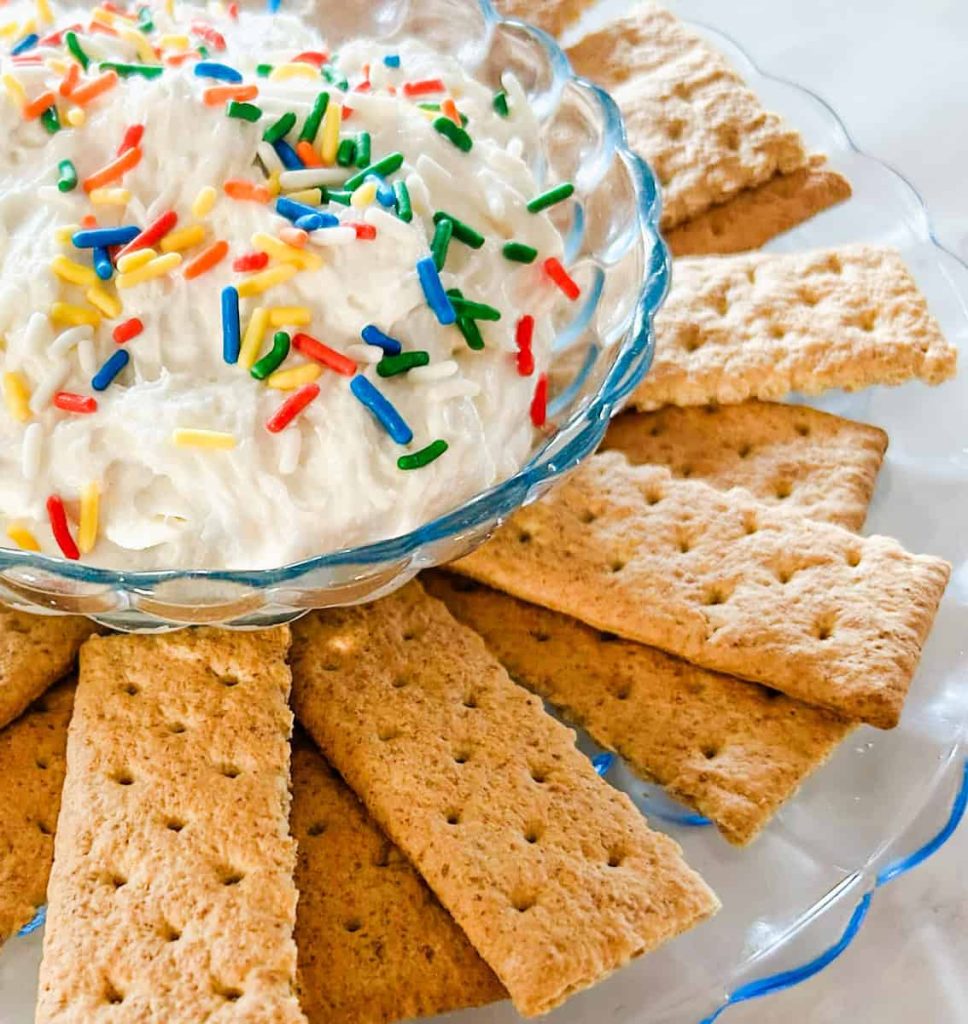 funfetti cake mix dip close up with graham crackers next to it