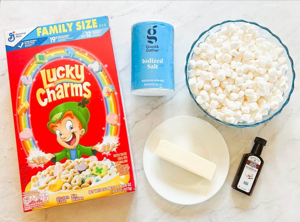materials for Lucky Charms Treats including a box of lucky charms, salt, butter, vanilla and marshmallows