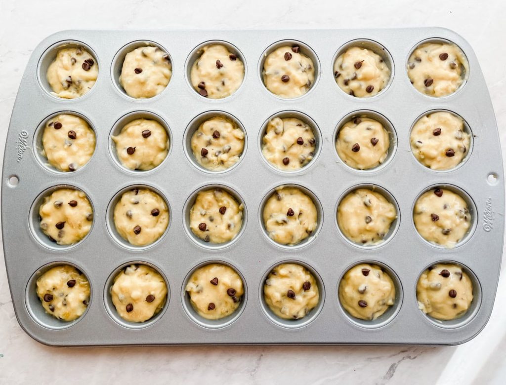 mini muffin tin filled with muffin batter
