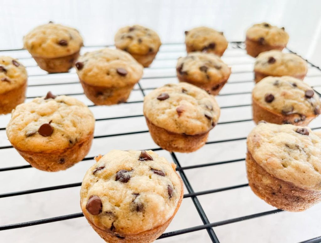 mini banana chocolate chip muffins on a wire rack