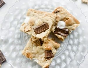 3 smores bars sitting on a plate