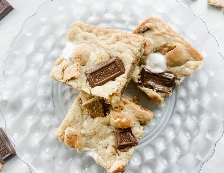 3 smores bars sitting on a plate