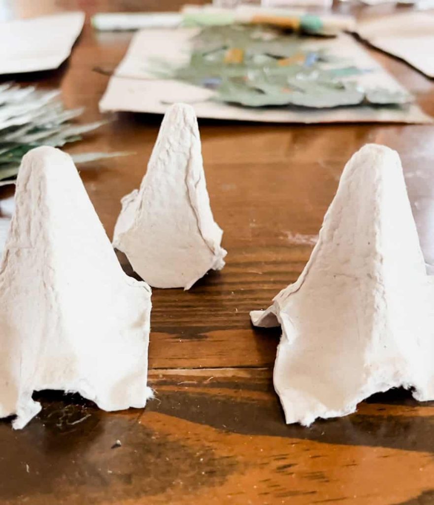 cut out bell shapes from egg carton
