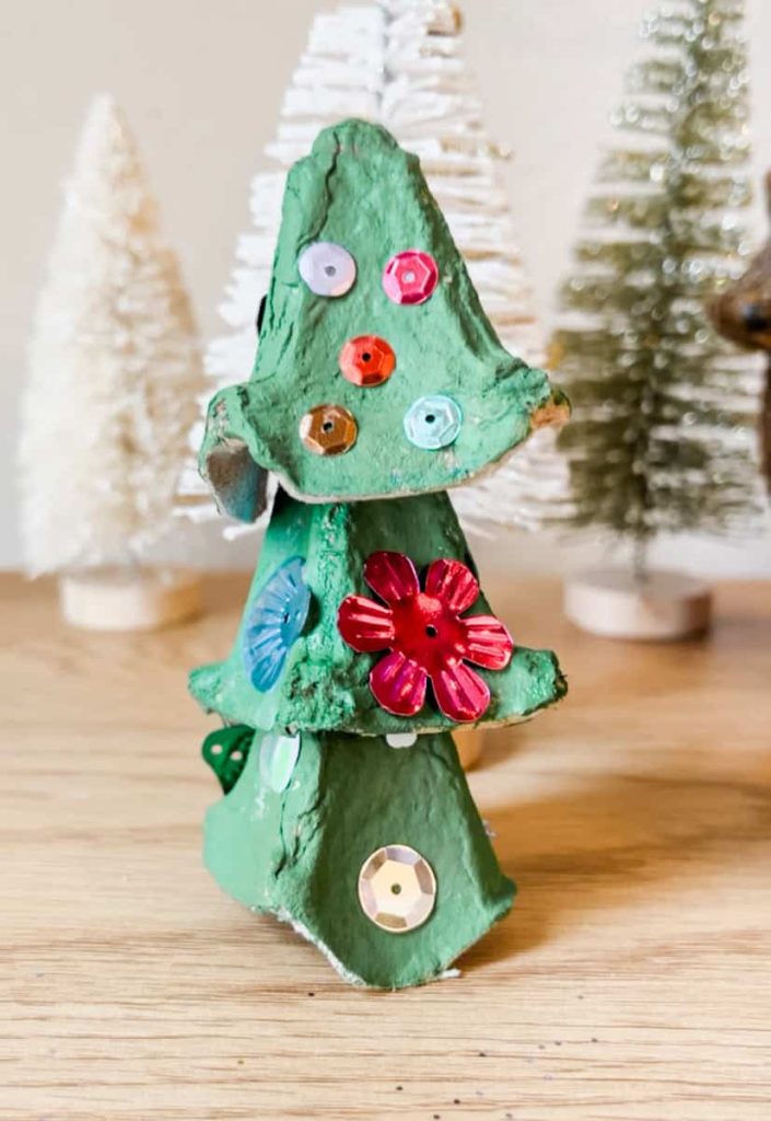 finished egg carton christmas tree craft on counter