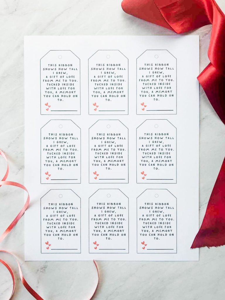 the paper with the gift tags printed off on it and ribbons around it