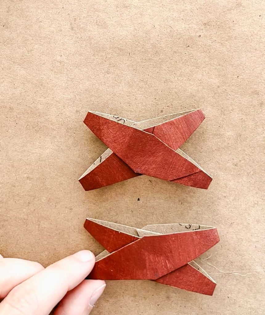 2 tp roll strips glued together to make an x 