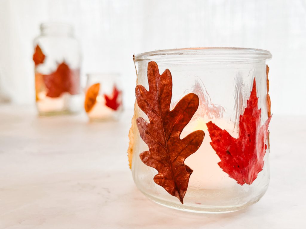 close up of a small leaf lantern with two other leaf lanterns in the background