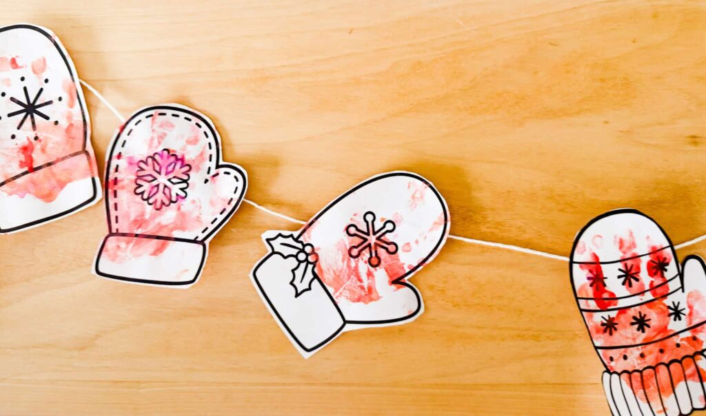 Mitten Garland Craft finished and laid on wooden table