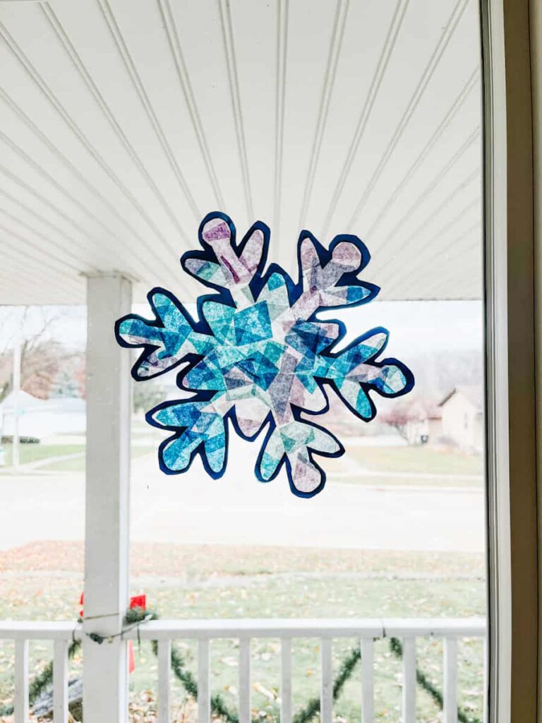 finished snowflake suncatcher on window