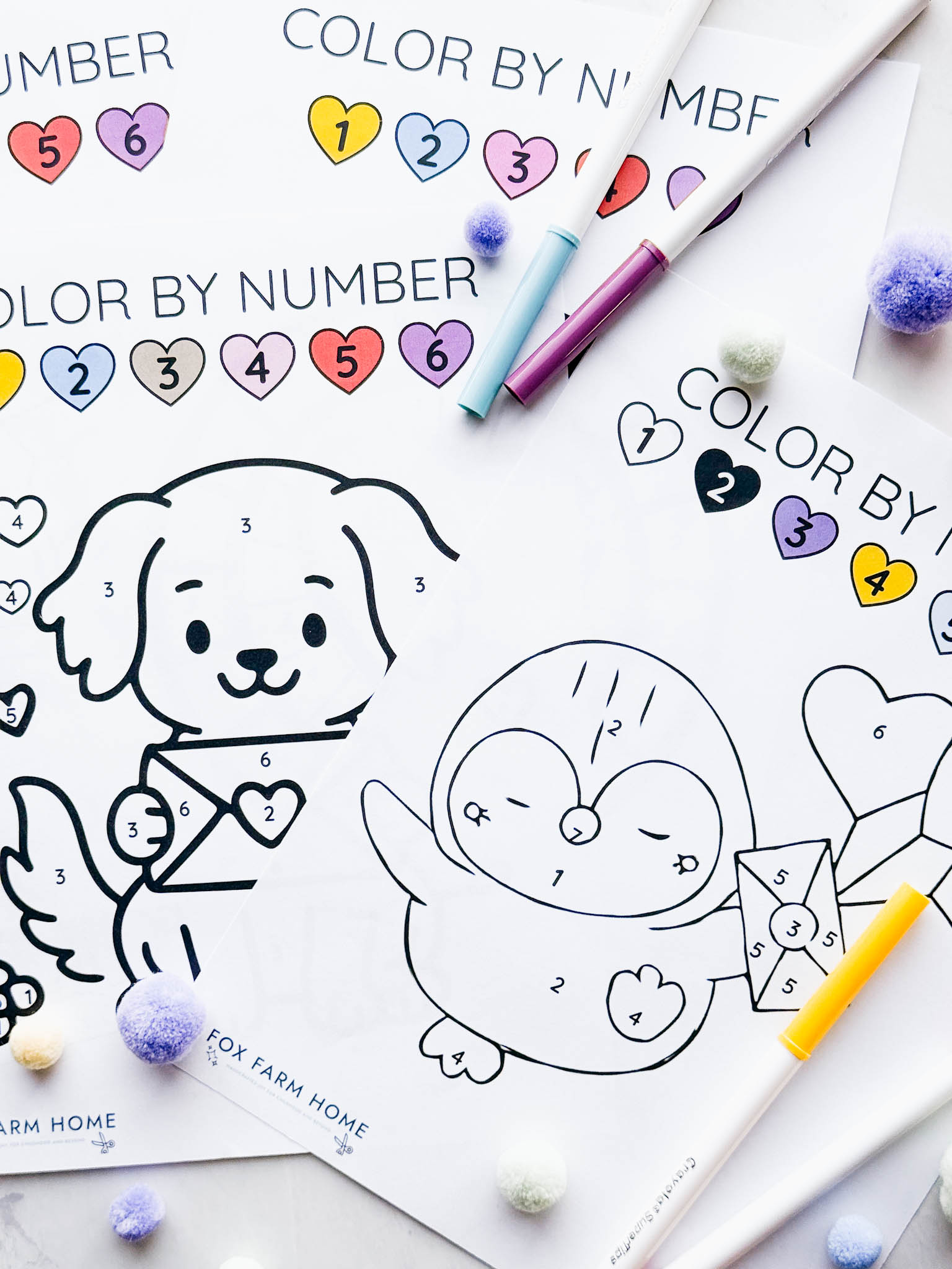 color by number sheets unfinished with markers on top of them