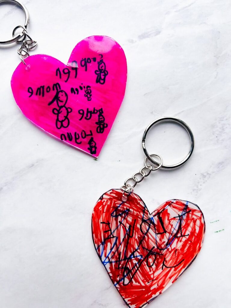 2 completed shrinky dink hearts colored by kids