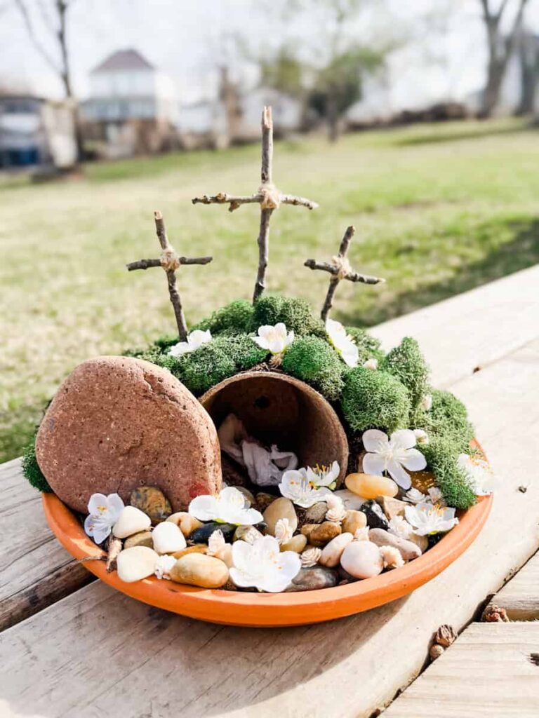 finished easter resurrection garden sitting on a bench outside 