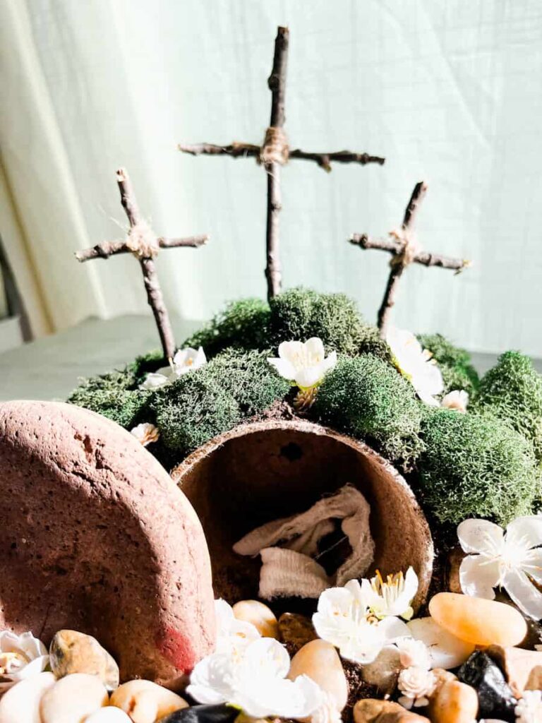 finished resurrection garden sitting on a countertop inside in front of white curtain