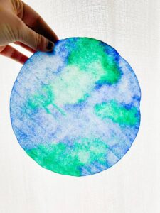 hand holding the coffee filter earth suncatcher