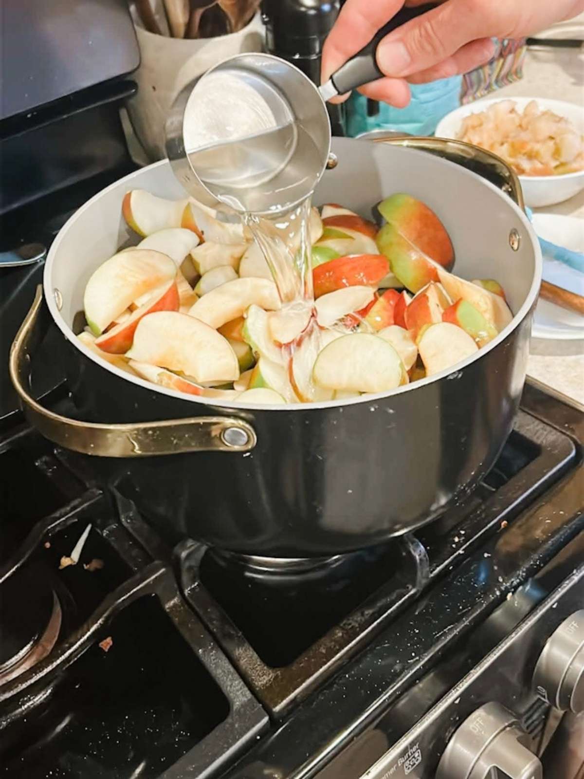 cut apples in pot on stove ready to cook.